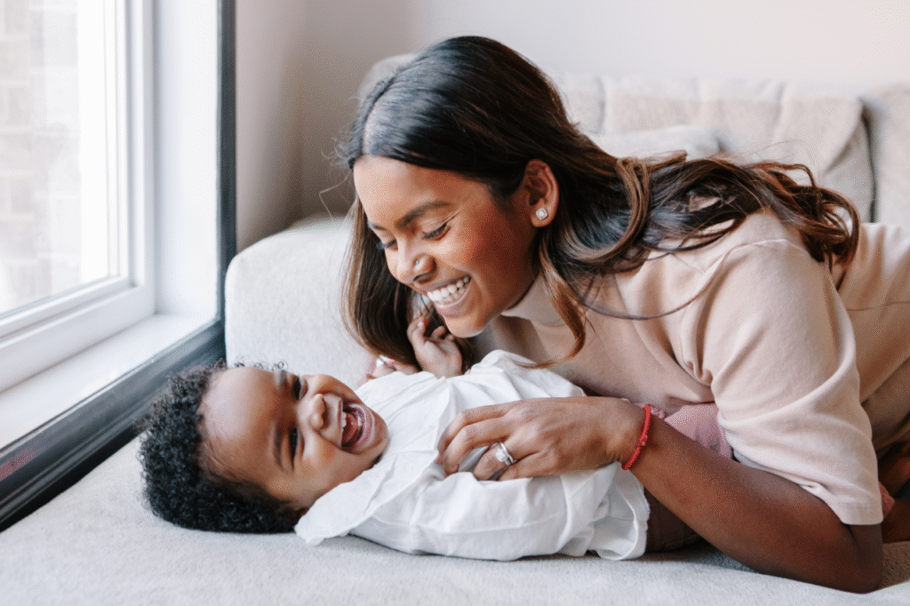 Baby dressing and giggling